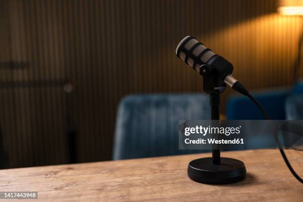 microphone on desk at radio station - microphone desk stock pictures, royalty-free photos & images