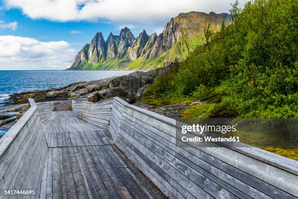 norway, troms og finnmark, tungeneset observation point overlooking devils jaw rugged coastline of senja island - finnmark county stock pictures, royalty-free photos & images