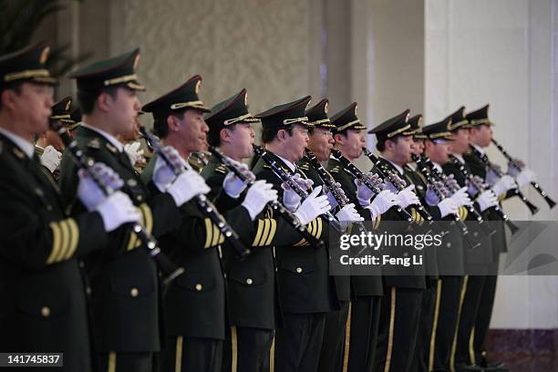 Members from a military band perform during the rehearsal ahead of a welcoming ceremony for Indonesia's President Susilo Bambang Yudhoyono inside the...