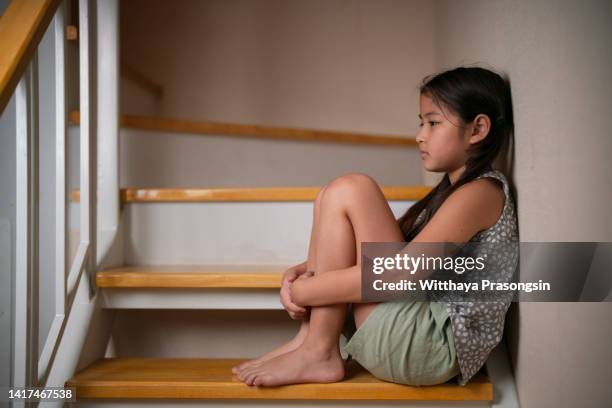 little boy unhappy sad and tress alone - boy thailand stock-fotos und bilder