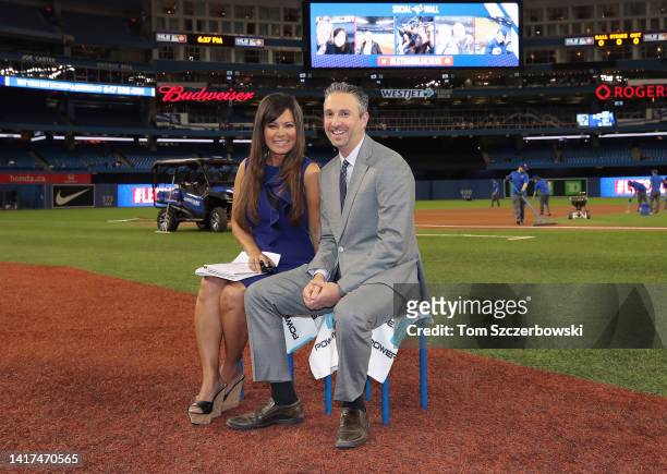 Sportsnet sportscasters Hazel Mae and Shi Davidi pose before doing live television commentary before the start of MLB game action between the Chicago...