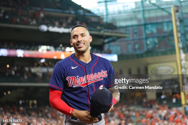 Carlos Correa of the Minnesota Twins walks out of the dugout in his first visit back to Minute Maid Park to face the Houston Astros on August 23,...