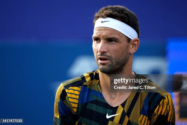 Grigor Dimitrov of Bulgaria looks on during the second round match against Dominic Thiem of Austria on day four of the Winston-Salem Open at Wake...