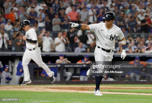 Oswaldo Cabrera of the New York Yankees gestures towards his dugout after drawing a bases loaded walk during the fourth inning against the New York...