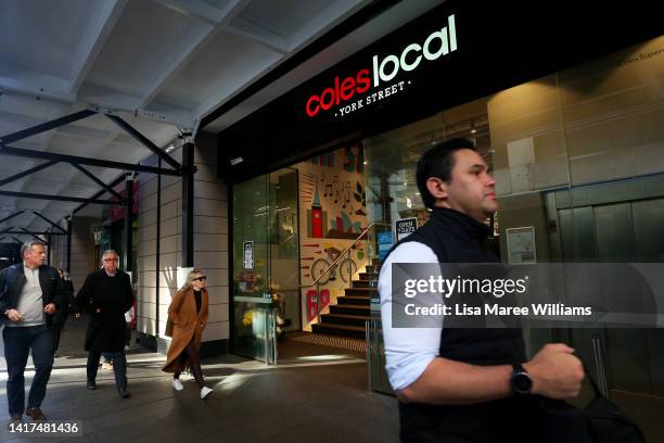 Pedestrians walk past a Coles supermarket on York Street on August 24, 2022 in Sydney, Australia. Supermarket chains Woolworths and Coles will...