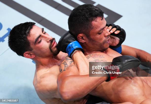 Jesus Aguilar of Mexico works for a submission against Erisson Ferreira of Brazil in a flyweight fight during Dana White's Contender Series season...