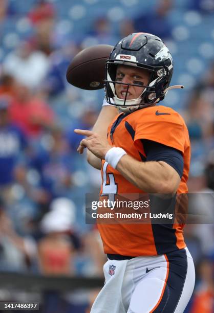 Brett Rypien of the Denver Broncos throws a pass before a preseason game against the Buffalo Bills at Highmark Stadium on August 20, 2022 in Orchard...