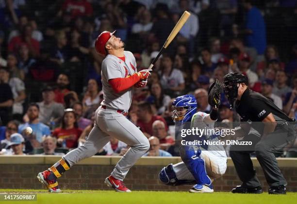 Nolan Arenado of the St. Louis Cardinals gets hit by a pitch during the eighth inning of Game Two of a doubleheader against the Chicago Cubs at...