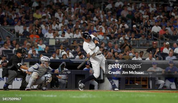 Aaron Judge of the New York Yankees connects on his seventh inning RBI base hit against the New York Mets at Yankee Stadium on August 23, 2022 in New...