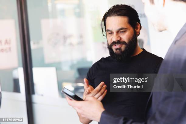 aboriginal australian colleagues - aboriginal man imagens e fotografias de stock