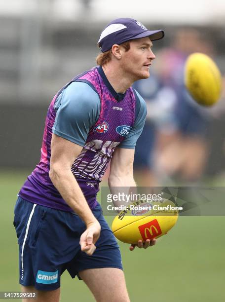 Gary Rohan of the Cats controls the ball during a Geelong Cats AFL and AFLW media opportunity at GMHBA Stadium on August 24, 2022 in Geelong,...