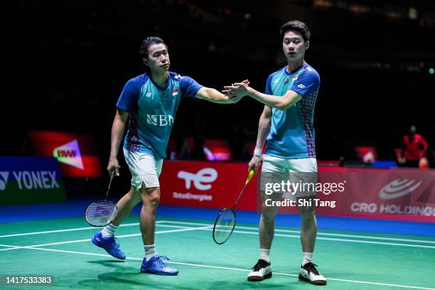 Marcus Fernaldi Gideon and Kevin Sanjaya Sukamuljo of Indonesia react in the Men's Doubles Second Round match against Jaromir Janacek and Tomas...