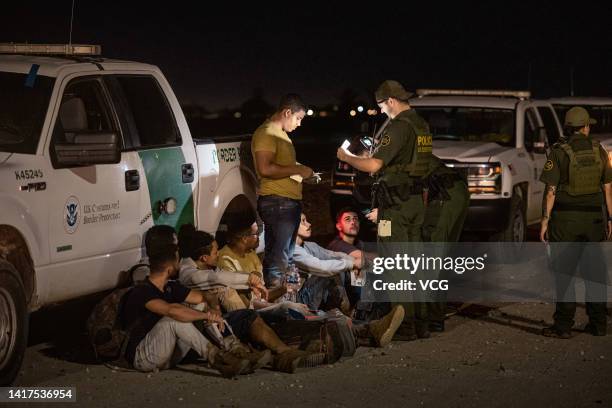 Immigrants are processed by the U.S. Border Patrol after crossing the border from Mexico on August 20, 2022 in Yuma, Arizona.