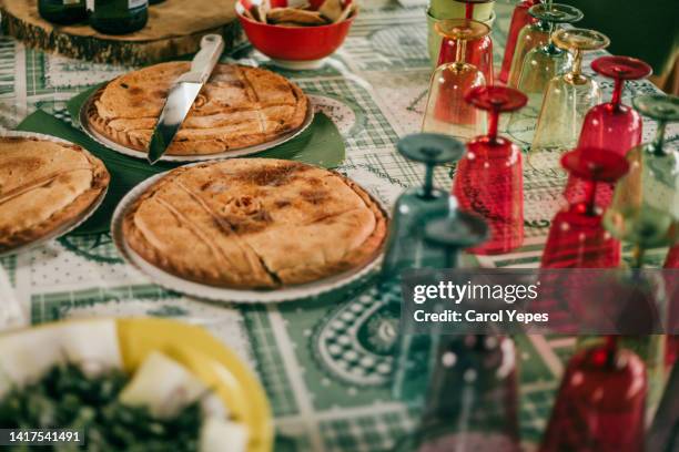 typical gallegas empanadas  setting on table - empanada imagens e fotografias de stock