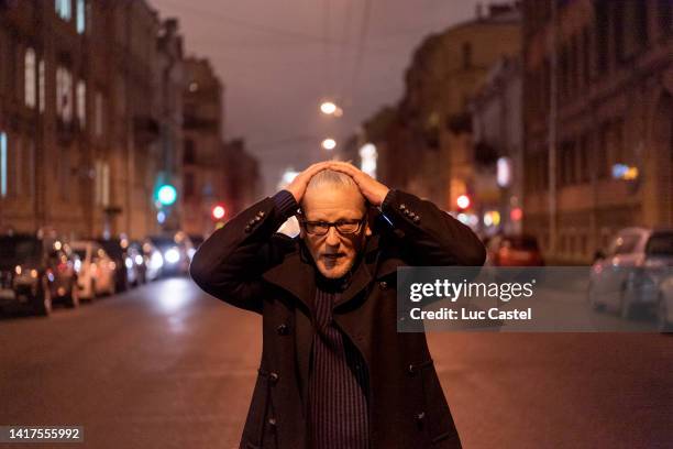 Belgian Artist Jan Fabre poses in the Streets of Saint Petersburg by Night on October 13, 2016 in Saint Petersburg, Russia.