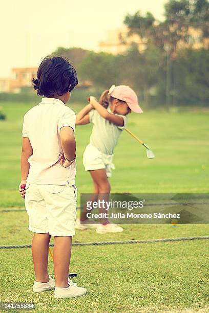 playing golf - golf lessons stock pictures, royalty-free photos & images