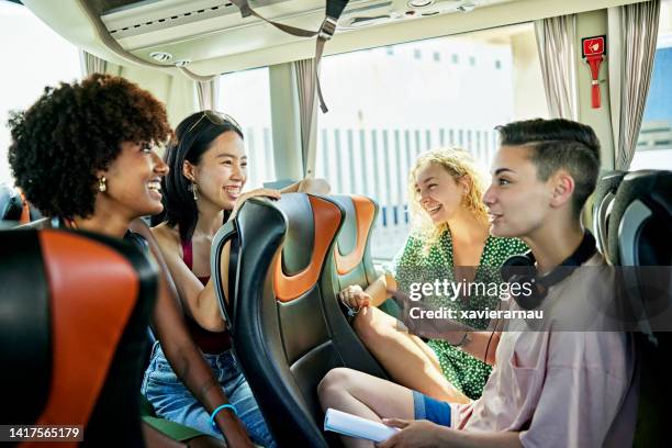 female friends talking onboard charter bus - coach bus 個照片及圖片檔
