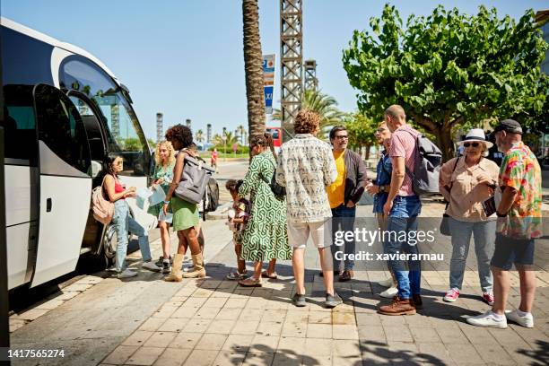 travelers waiting in line to board deluxe motor coach - tour bus stock pictures, royalty-free photos & images