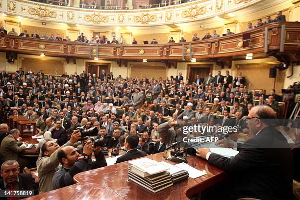 Newly elected speaker of the Egyptian parliament, Saad al-Katatni of the Muslim Brotherhood, addresses the parliament during the first session of the...