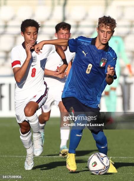 Alessandro Di Nunzio of Italy is challenged by Josh King of England during the International Friendly Match between Italy U16 v England U16 at Stadio...