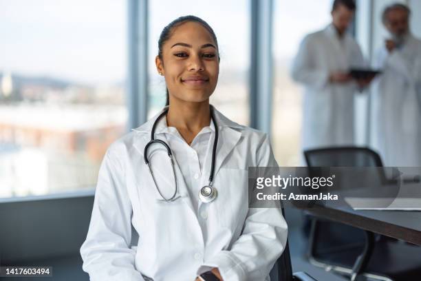 portrait of a young adult female doctor with stethoscope - jamaican ethnicity imagens e fotografias de stock