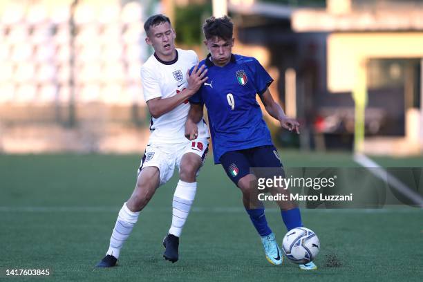 Mattia Mosconi of Italy is challenged by Chris Rigg of England during the International Friendly Match between Italy U16 v England U16 at Stadio...
