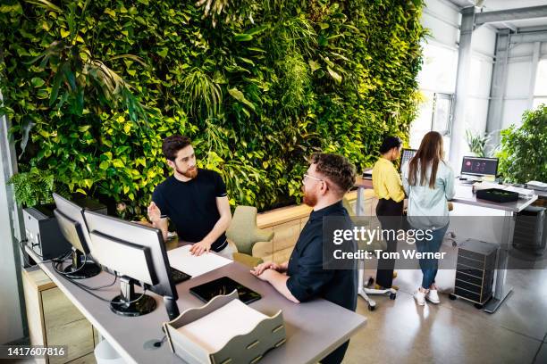 busy, green office space with large botanical display - ginger bush stock pictures, royalty-free photos & images