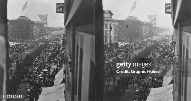 Stereoscopic image showing crowds of people watching an procession outside the Democratic State Convention, in Rochester, New York, October 1871.