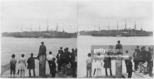 Stereoscopic image showing a rear view of people on a quayside watching the SS Great Eastern, an iron steamship designed by Isambard Kingdom Brunel,...