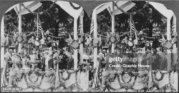 Stereoscopic image showing American politician Calvin Coolidge , President of the United States, present American aviator Charles Lindbergh with the...