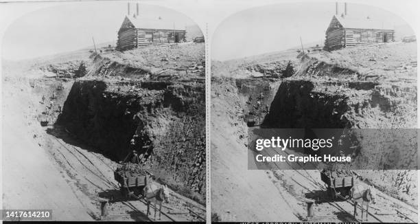 Stereoscopic image showing a horse-drawn spoil cart during construction of the Bozeman Tunnel, a 1,113-metre long tunnel beneath the Bozeman Pass on...