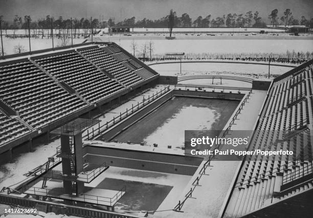 Aerial view from the Olympiastadion of the recently constructed Olympiapark Schwimmstadion covered by a layer of snow in the Olympiapark in Berlin,...