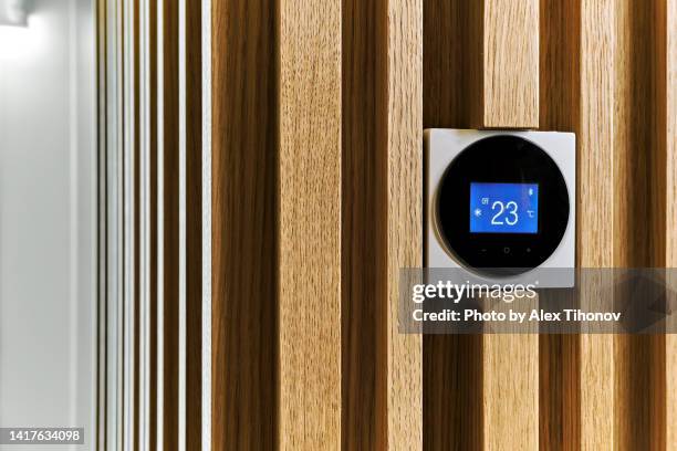 remote air-conditioner inside smart home close up view - celsius foto e immagini stock