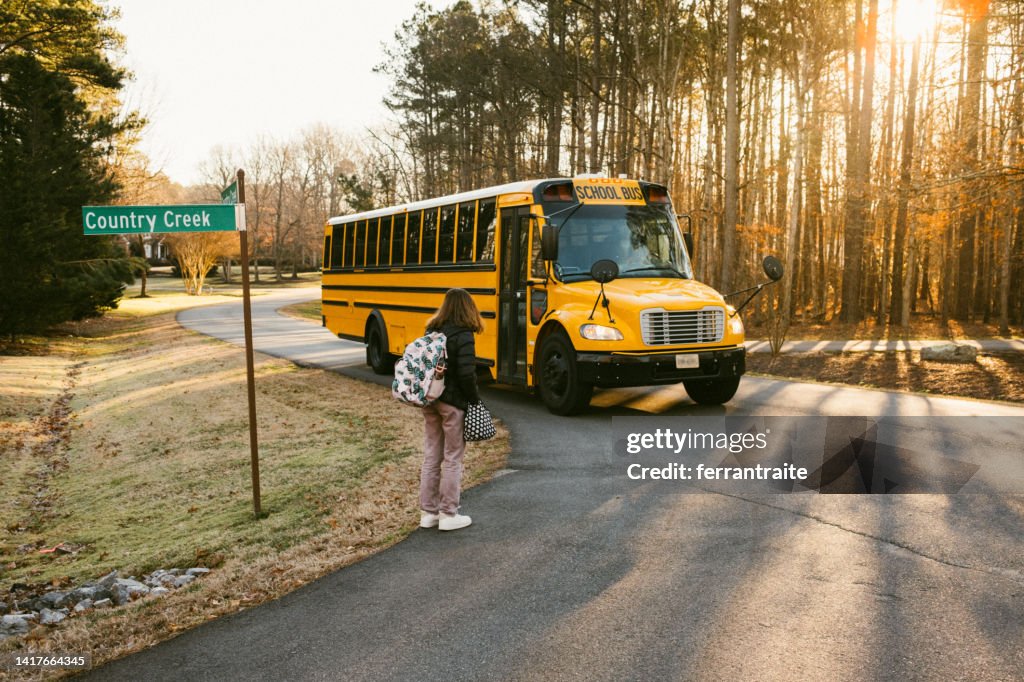 Junior High Student wait at School Bus Stop