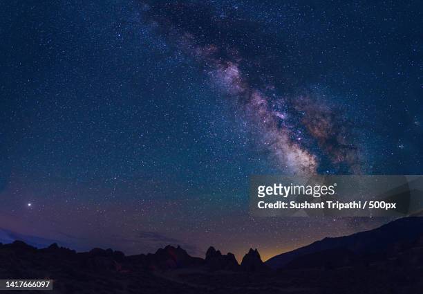 scenic view of mountains against sky at night,alabama hills,united states,usa - alabama hills stock-fotos und bilder