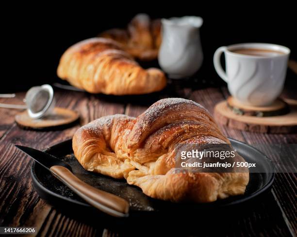 close-up of croissant with croissants on table,loranca,spain - croissant viennoiserie stock-fotos und bilder