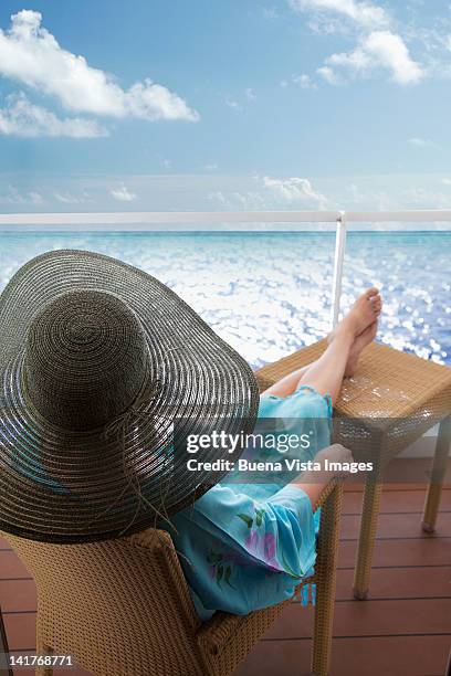 woman relaxing outside her cabin on a cruise ship - cruise deck stock pictures, royalty-free photos & images