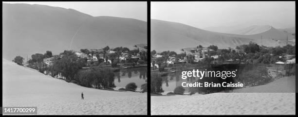 tourist standing at desert oasis, huacachina, inca lima, peru - huacachina stock pictures, royalty-free photos & images