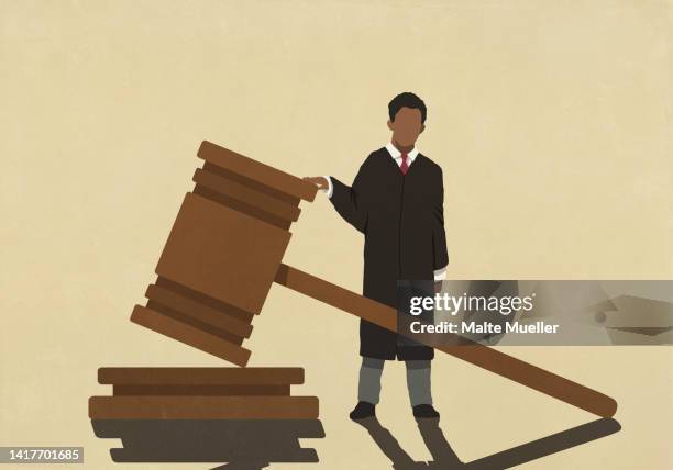 male judge standing at large gavel - urteil konzepte stock-grafiken, -clipart, -cartoons und -symbole