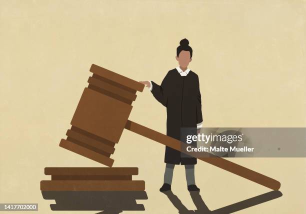 female judge standing at large gavel - judgement stock illustrations