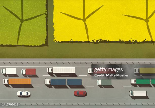 view from above shadows of wind turbines above trucks and cars on freeway - renewable energy illustration stock illustrations