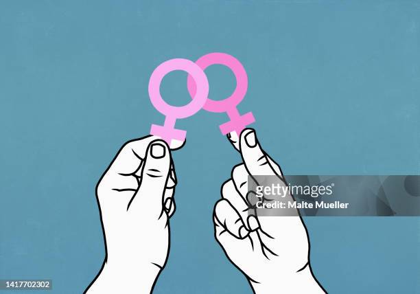 hands holding pink female symbols - lesbian stock illustrations