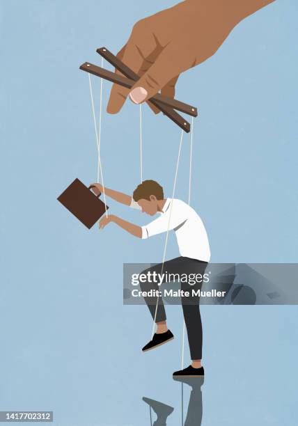 hand controlling businessman on puppet strings - marionette stock-grafiken, -clipart, -cartoons und -symbole