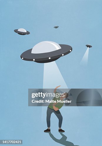 UFO light hovering over afraid man UFO light hovering over afraid man