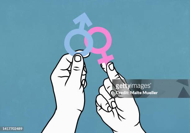 hands holding pink female symbol and blue male symbol - gender 幅插畫檔、美工圖案、卡通及圖標