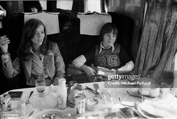 Astrid Lundstrom, then partner of Bill Wyman of the Rolling Stones, with her son, en route from Manchester by train during the 1973 UK tour.