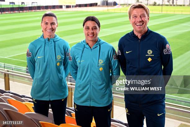 Australia's soccer captain Sam Kerr and vice-captain Steph Catley pose for photos with coach Tony Gustavsson in Melbourne on July 3, 2023 after...