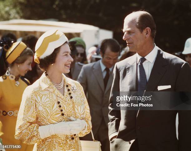 Queen Elizabeth II and Prince Philip in New Zealand during their Commonwealth Tour, 1974. Behind them are Princess Anne and her husband Mark Phillips.