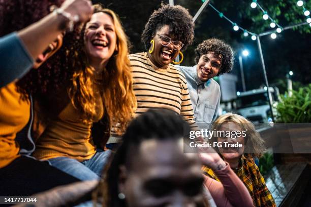 friends watching a sports game and celebrating outdoors - recreational sports league stock pictures, royalty-free photos & images