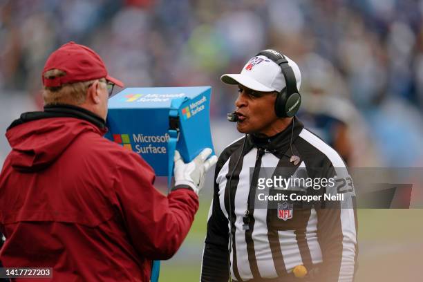 Referee Jerome Boger reviews instant replay on a Microsoft Surface tablet during an NFL football game between the New Orleans Saints and the...